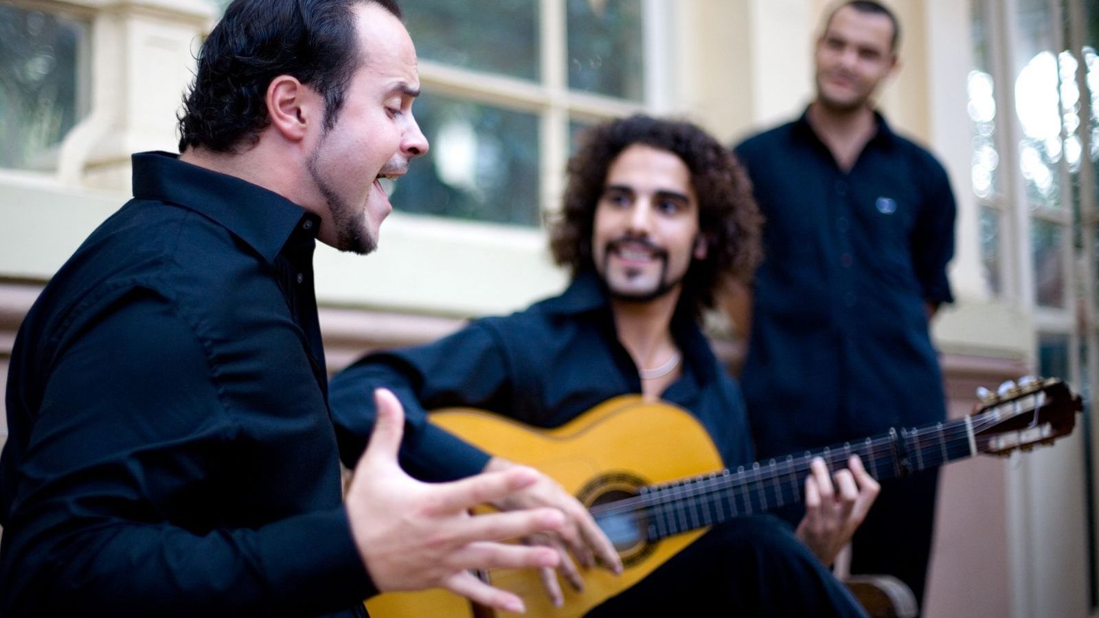 Flamenco singer and guitarist performing in Seville